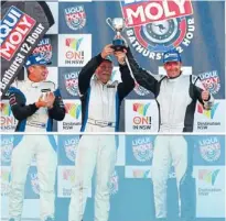  ??  ?? Kiwi spirit: From left, Stu Owers, Lewis Scott, and Richard Billington celebrate their win at Bathurst.