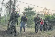  ?? NYT ?? Members of the Revolution­ary Armed Forces of Colombia, or FARC, in the mountains of Colombia in March 2016.