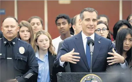  ?? Patrick T. Fallon For The Times ?? L.A. MAYOR Eric Garcetti has eased up on his criticism of President-elect Donald Trump. They spoke last week by phone, and the mayor said he’s willing to work with Trump on infrastruc­ture and the economy. Above, the mayor at Theodore Roosevelt High...