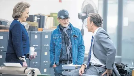  ?? NIKO TAVERNISE ?? Meryl Streep, left, on the set of “The Post,” with director Steven Spielberg, center, and actor Tom Hanks. It arrives in Central Florida today.