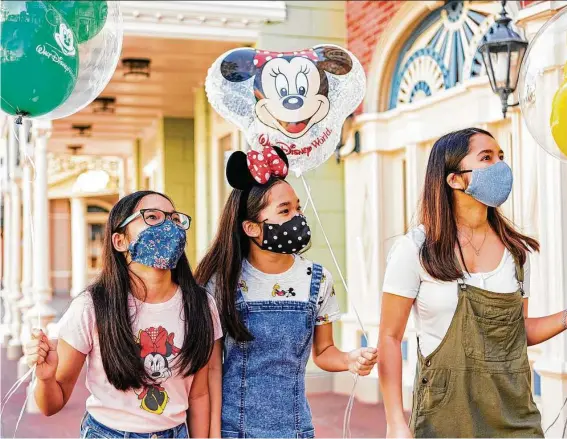  ?? Walt Disney World Resort / TNS ?? All guests 2 years and older at Disney theme parks in the U.S. are now required to don face masks while indoors — a precaution against the spread of the highly infectious COVID-19 delta variant.