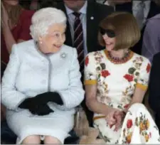  ?? YUI MOK/POOL PHOTO VIA AP ?? Britain’s Queen Elizabeth sits next to fashion editor Anna Wintour as they view Richard Quinn’s runway show before presenting him with the inaugural Queen Elizabeth II Award for British Design, as she visits London Fashion Week’s BFC Show Space in...