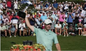  ?? Photograph: Steve Helber/AP ?? Rory McIlroy holds aloft the Calamity Jane trophy after winning the 2022 Tour Championsh­ip.