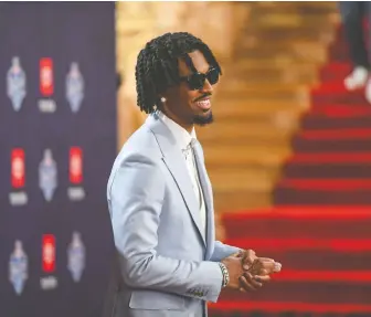  ?? AARON J. THORNTON/GETTY IMAGES ?? LSU quarterbac­k Jayden Daniels arrives at the Fox Theatre in Detroit ahead of Thursday night's NFL draft. Daniels was chosen second overall by the Washington Commanders.
