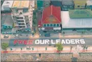  ?? AFP ?? This aerial photo shows a huge sign with a message "free our leaders" displayed along a coastal road in Myeik district.