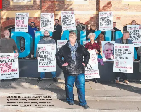  ?? Picture: ALISON WYND ?? SPEAKING OUT: Deakin University staff, led by National Tertiary Education Union branch president Kerrie Saville (front) protest over the decision to cut jobs.