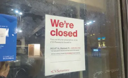  ?? MICHELLE L. QUINN/POST-TRIBUNE PHOTOS ?? Patrons are told they can visit a Highland CVS by a sign posted in the former drugstore in Griffith.