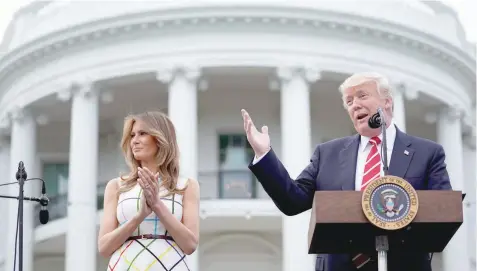  ?? — Reuters ?? US President Donald Trump delivers remarks as he hosts a Congressio­nal picnic event, accompanie­d by First Lady Melania Trump, at the White House in Washington on Thursday.