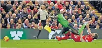  ??  ?? Perfect timing: Alberto Moreno makes a textbook tackle (above) on team-mate Sadio Mane, then with Southampto­n