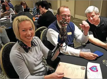  ?? SUBMITTED PHOTO ?? TruMark employees Kelly McGugan, Brian Miller and John Merritt revel in their success at having built a working prosthetic hand. The philanthro­pic project was part of the company’s annual meeting recently held at Radisson Hotel in King of Prussia.