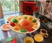  ??  ?? The Summer Palace Restaurant offers new and traditiona­l yee sang to toss for a successful new year ahead.