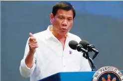  ?? — AP ?? PASAY CITY: In this Thursday, Oct 13, 2016, file photo, Philippine President Rodrigo Duterte gestures during his address to a Filipino business sector.