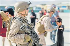  ?? REUTERS ?? A US Marine stands guard during an evacuation operation at the airport in Kabul.
Medical supplies blocked