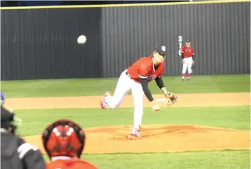  ?? Photo by Terri Perry ?? ■ Hughes Springs senior pitcher Cooper Perry throws a breaking ball during a 2020 high school baseball game.