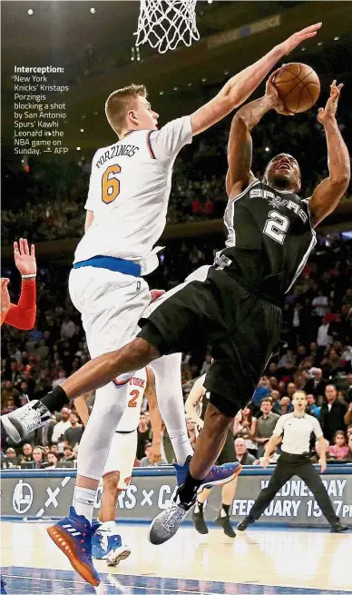  ??  ?? Intercepti­on: New York Knicks’ Kristaps Porzingis blocking a shot by San Antonio Spurs’ Kawhi Leonard in the NBA game on Sunday. — AFP