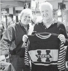  ?? SUBMITTED PHOTO ?? Hall of Fame curator Phil Pritchard, left, and Russ Boychuk with what might be the only known 1925 Hamilton Tigers sweater known to exist.