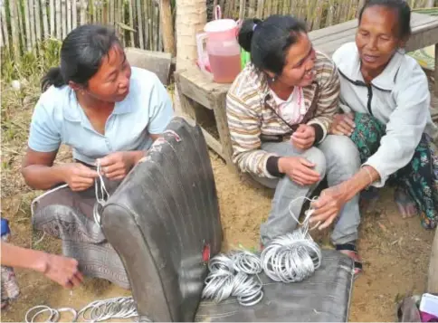  ?? — Reuters photo ?? Suda works with about a dozen families in Xieng Khouang, sending designs for earrings, pendants and ornaments that the villagers fashion in their kilns. They are finished in capital Vientiane, then shipped to New York.