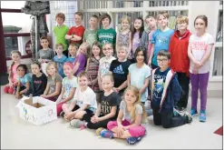  ?? NEWS PHOTO EMMA BENNETT ?? Grade 3 students at Medicine Hat Christian School have taken a keen interest in researchin­g plastics recycling.