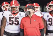  ?? UGa sports Communicat­ions — Tony Walsh ?? Georgia head coach Kirby Smart and Georgia offensive lineman Trey Hill before a game against South Carolina at Williams-Brice Stadium in Columbia, SC., in 2020.