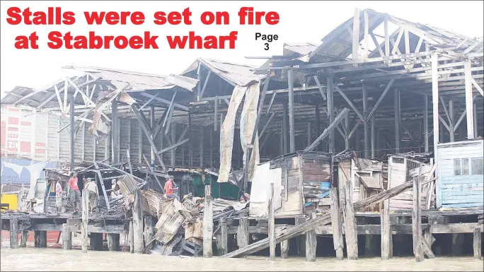  ??  ?? A burnt section of the Stabroek Market wharf (Photo by Terrence Thompson)