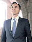  ?? THE CANADIAN PRESS FILES ?? Finance Minister Bill Morneau in Ottawa on Dec. 13. A new report from the federal Finance Department says better-than-expected economic growth in 2017 shaved several years of projected deficits from Canada’s long-term financial future — though many...