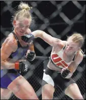  ?? NAM Y. HUH/THE ASSOCIATED PRESS ?? Valentina Shevchenko lands a solid right hand to the jaw of former UFC champion Holly Holm during their women’s bantamweig­ht main event at UFC on Fox 20 on Saturday at United Center in Chicago. Shevchenko handed Holm her second straight defeat, winning...