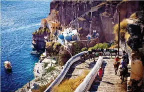  ??  ?? SLIPPERY SLOPE: Take care navigating Santorini’s clifftop delights