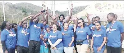  ?? ?? Men’s elite winners Correction­al celbrating along with their ladies counterpar­ts as they lift the trophy.