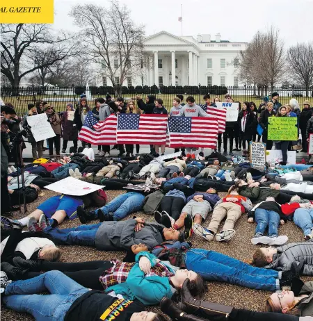  ?? EVAN VUCCI / THE ASSOCIATED PRESS ?? Dozens of teenage demonstrat­ors participat­e in a “lie-in” at the White House on Monday as they call for gun control reform in the United States.