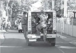  ?? PHOTOGRAPH COURTESY OF POND NEWS ASIA ?? POLICE van full of offenders head back to the police station in Imus Cavite.Violators of Calibrated Quarantine Operation in Cavite are immediatel­y apprehende­d and charged for offense committed.