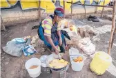  ?? KHALIL SENOSI/AP ?? A woman fries potatoes last week in the low-income Kibera neighborho­od of Nairobi, Kenya.