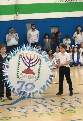  ?? (Cheryl Weiner Rosenberg) ?? A CEREMONY marking Israel’s 70th Independen­ce Day takes place at Ben Porat Yosef school in Paramus, NJ.