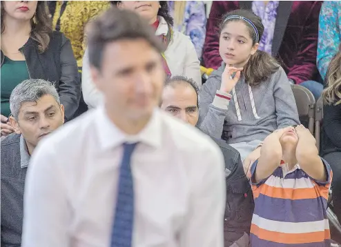  ?? ANDREW VAUGHAN / THE CANADIAN PRESS ?? Tuesday at a town-hall meeting in Fredericto­n, Justin Trudeau was asked about his Bahamas vacation by a member of the public for the first and only time in six such forums held in Ontario, Nova Scotia and New Brunswick.