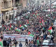  ?? PIERO CRUCIATTI/AFP VIA GETTY IMAGES ?? People march to demand an immediate cease-fire in the Gaza Strip on Saturday in Milan. Overall, at least 29,606 people have been killed in Gaza amid Israel’s ongoing war with the Palestinia­n militant group Hamas.