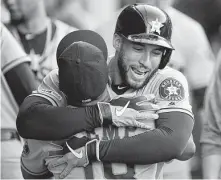  ?? Kyusung Gong / Associated Press ?? Astros outfielder George Springer, right, celebrates his solo home run in the third inning.