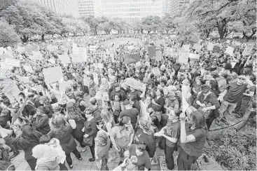  ?? Elizabeth Conley photos / Houston Chronicle ?? Marchers gather at Houston City Hall in what one organizer described as “the biggest crowd ever.”