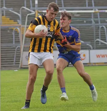  ??  ?? Conor Hearne of Shelmalier­s is challenged by Gusserane’s Jack O’Connor during their Tom Doyle Supplies SFC Group B match in Innovate Wexford Park on Saturday.