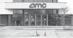  ?? BRUCE BENNETT/ GETTY IMAGES ?? AMC Theatres, shuttered since March due to the pandemic, lost $ 2.2 billion last quarter but is eyeing a July reopening.