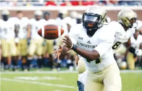  ?? FILE PHOTO BY THE ASSOCIATED PRESS ?? Wofford quarterbac­k Brandon Goodson led the Terriers to 10 wins and the FCS quarterfin­als last season.