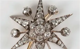  ?? ?? A late Victorian cushion cut diamond brooch, designed as a six-pointed starburst, circa 1890