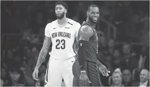  ?? JAE C. HONG/AP ?? Anthony Davis and LeBron James are going to be teammates after all.