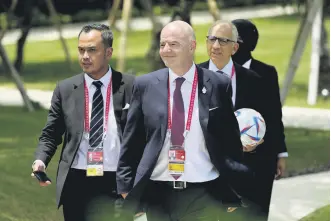  ?? ?? FIFA President Gianni Infantino (C) walks to attend a lunch as part of the G-20 leaders’ summit, Bali, Indonesia, Nov. 15 2022.