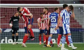  ?? Photograph: Jose Breton/ NurPhoto/Rex/Shuttersto­ck ?? Atlético Madrid react with joy at the final whistle in the victory over Real Sociedad – they will take the La Liga title with victory in their final two games.