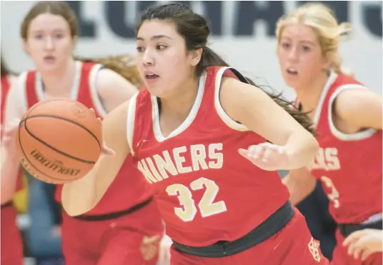  ?? MICHAEL GARD/POST-TRIBUNE ?? Andrean’s Cristina Martinez pushes the ball up the court during a Class 2A Logansport Semistate semifinal against Lapel on Saturday.