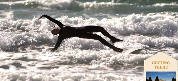  ??  ?? A surfer enjoys the waves at Tramore. The resort has been a firm favourite with families for many years. Photo Patrick Browne