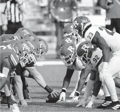  ?? JULIO CORTEZ/AP ?? When Maryland and Rutgers, lined up against one another during last year’s game on Dec. 12, 2020, square off on Saturday, a bowl bid will be on the line.