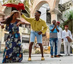  ??  ?? Poetry in motion: Cubans dancing the rumba in a street in Havana. — AFP