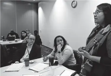  ?? ANGELA PETERSON /MILWAUKEE JOURNAL SENTINEL ?? Georgina Manley, right, partnershi­ps coordinato­r for the U.S. census, takes questions from participan­ts attending a census training session on Feb. 14, 2020, at 200 E. Pleasant St., Milwaukee.