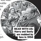  ?? ?? BEAR WITH US: Harry and Sooty are mobbed by fans in 1958