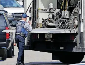  ??  ?? A robot is prepared for use in Pflugervil­le, Texas, on Wednesday where Austin bombing suspect Mark Anthony Conditt lived.
